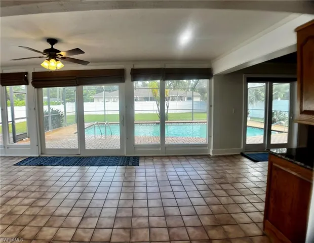 View of sunroom and pool