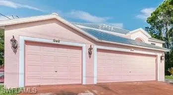 Garage featuring concrete driveway