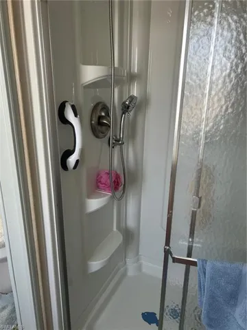 Full bath with a shower stall