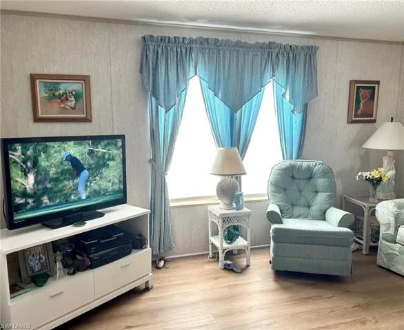 Sitting room with wood finished floors