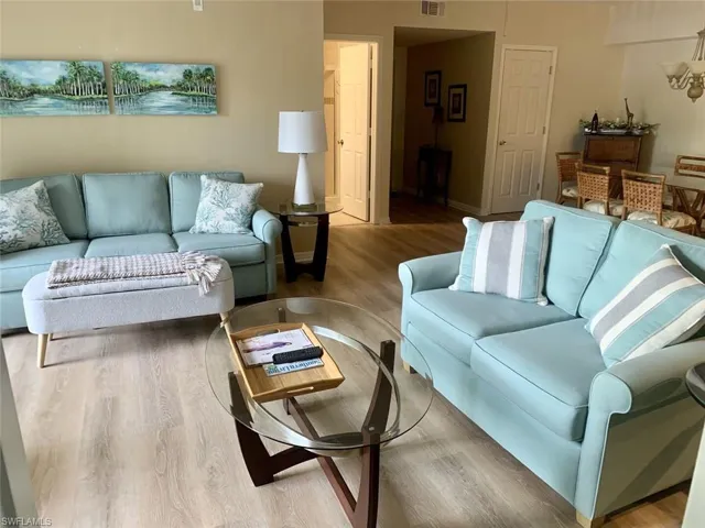Living area featuring wood finished floors and baseboards