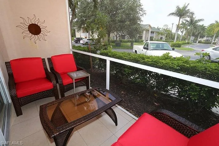 Lanai with a residential view & Parking area