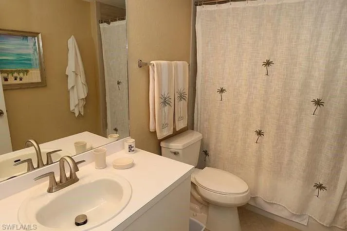 Bathroom featuring vanity and shower / tub combo