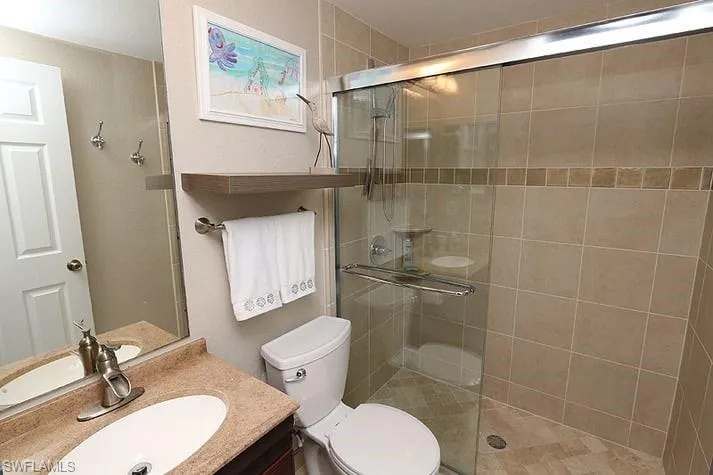 Full bath featuring vanity and a stall shower