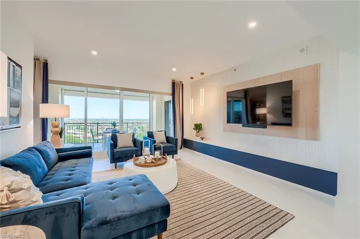 Living room with recessed lighting and baseboards