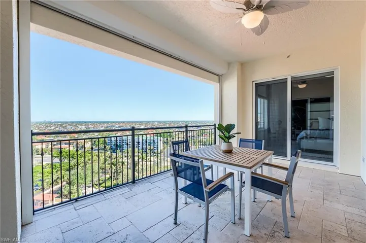 Balcony featuring ceiling fan and outdoor dining space