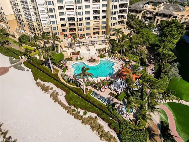 Aerial view of a pool area and apartment complex