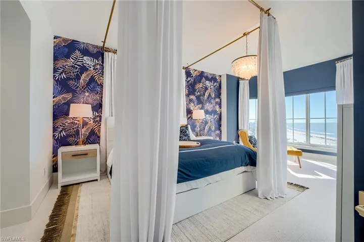 Bedroom with a towering ceiling