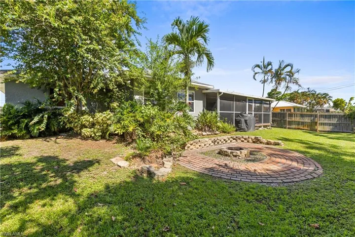 View of yard with a patio and a sunroom