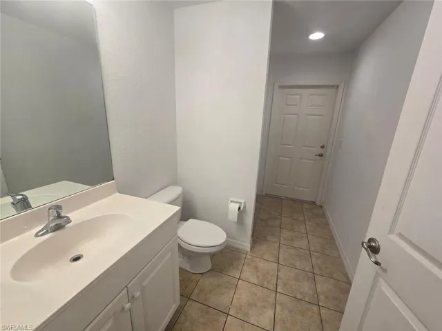 Bathroom with vanity and light tile patterned floors