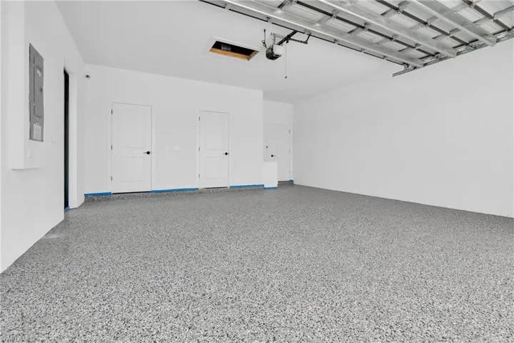 Epoxy-coated concrete flooring with a neutral speckled finish