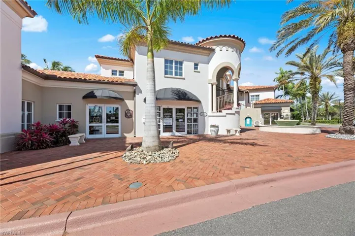 Mediterranean / spanish-style home featuring french doors, stucco siding, a tile roof, and a balcony