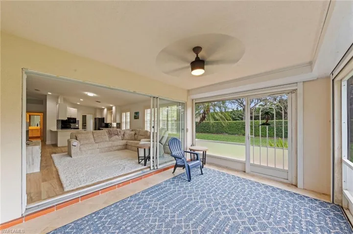 Sunroom / solarium with ceiling fan and lofted ceiling
