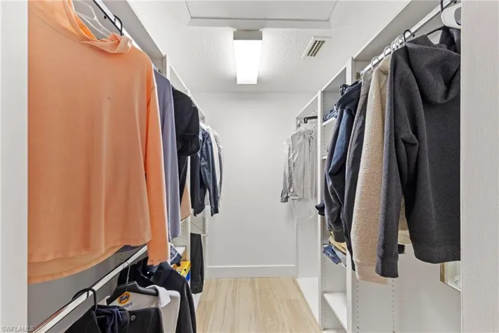 Walk in closet featuring light wood-type flooring