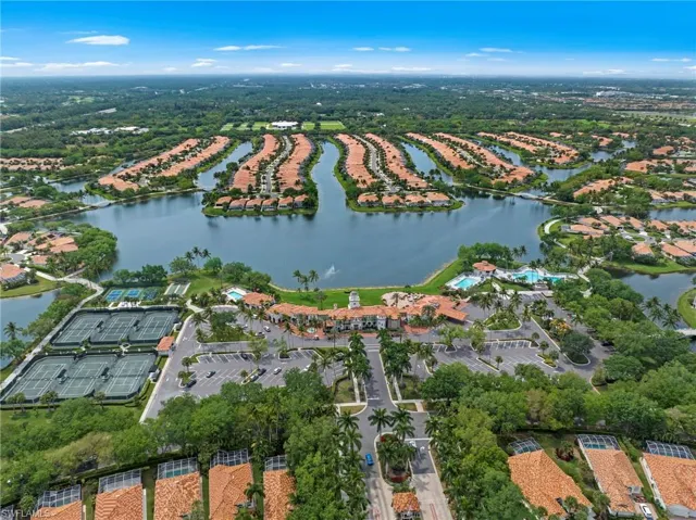 Aerial view of property and surrounding area featuring a large body of water