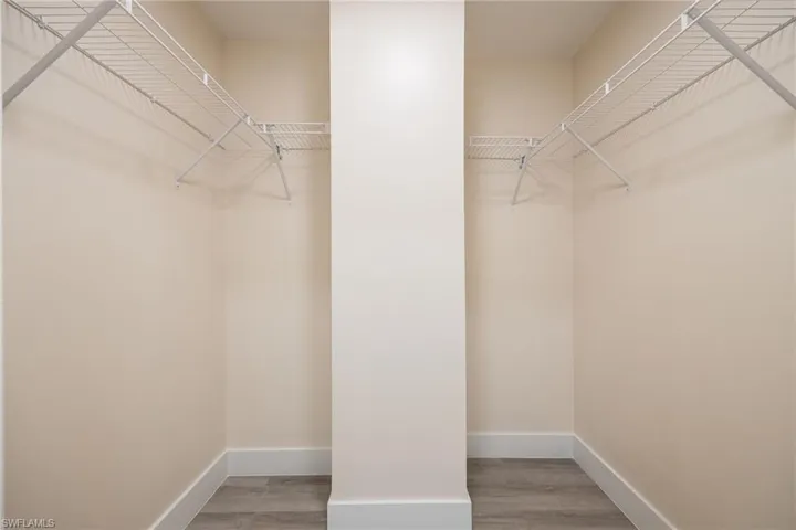 Spacious closet with wood finished floors