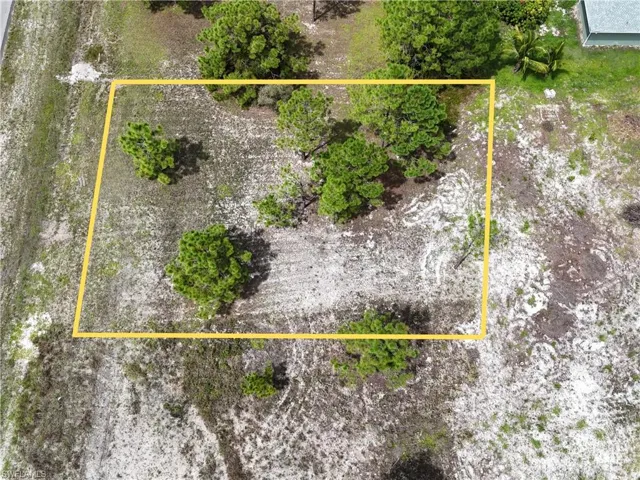 Aerial view of property's location featuring property parcel outlined