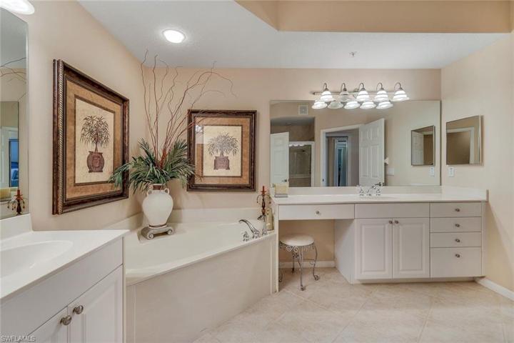 Master Bath with separate shower and deep soaker tub. His and her sinks and make up vanity
