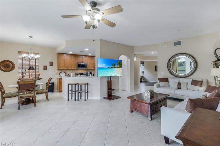 Spacious grand room facing dining, kitchen and den
