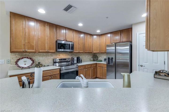 Breakfast bar view of kitchen and pantry
