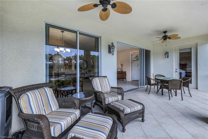 Tiled Lanai with seating and dining and door to master suite