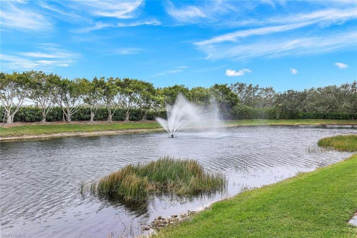 Pond view from screened lanai with fountain