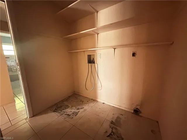 Washroom featuring hookup for a washing machine and electric dryer hookup