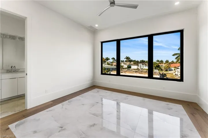 Spare room with light wood-style flooring, ceiling fan, and recessed lighting