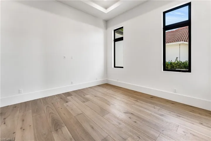Spare room with light wood finished floors and baseboards