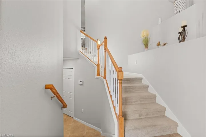 Staircase featuring tile patterned flooring