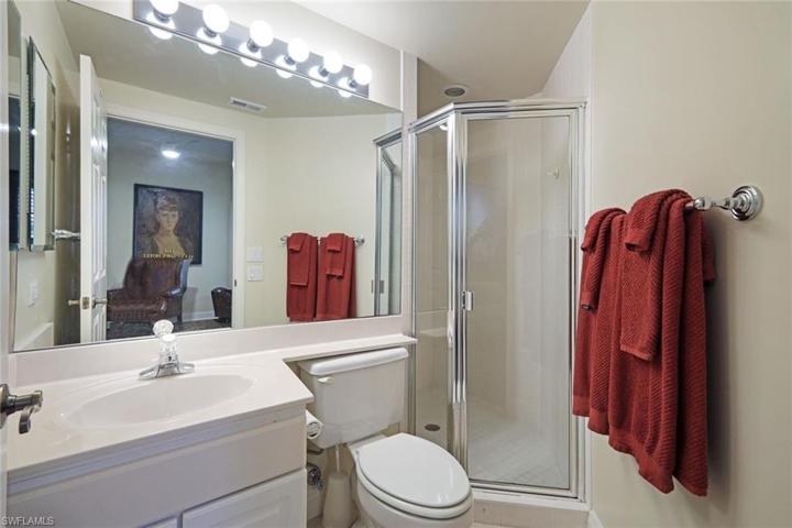 En suite guest bathroom with walk-in shower.