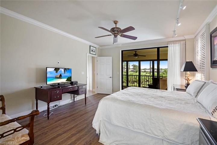 Primary bedroom with gorgeous view of the golf course.