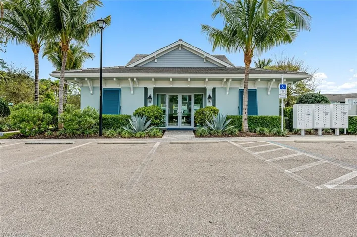 View of property featuring uncovered parking