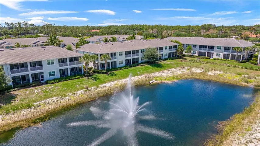 Aerial view featuring a residential view and a water view