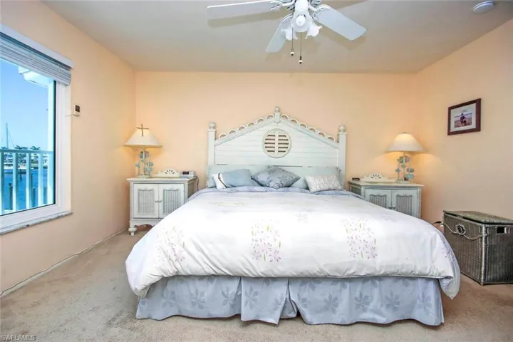 Bedroom with a ceiling fan and carpet floors