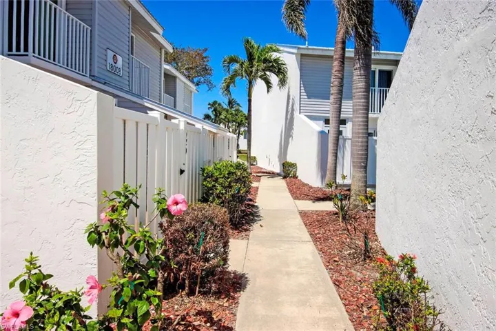 View of home's community with fence