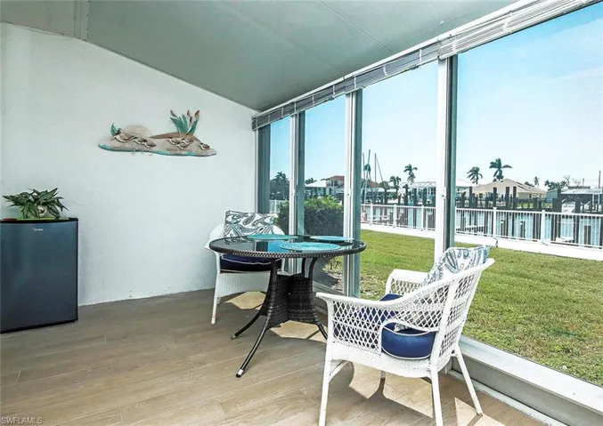 Sunroom with a water view