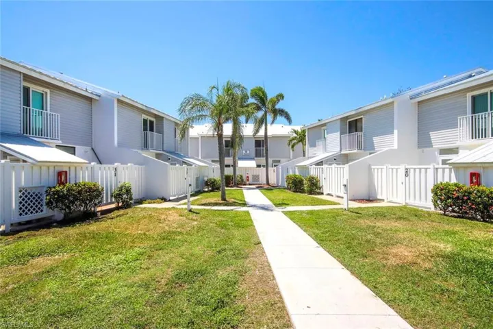 Surrounding community featuring a yard, fence, and a residential view