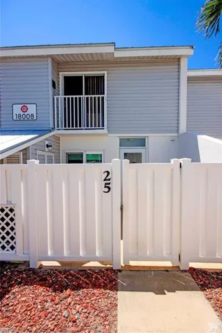 View of front of home featuring a gate and a fenced front yard