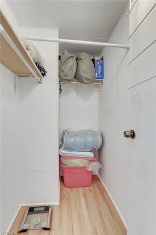 Walk in closet featuring light wood-type flooring
