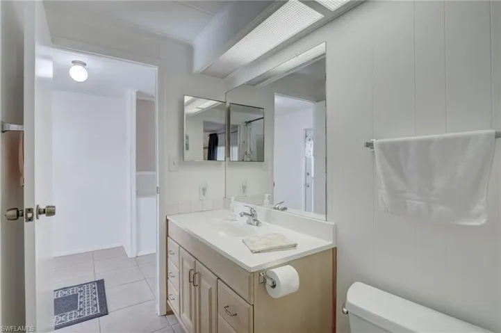 Bathroom with vanity and light tile patterned floors