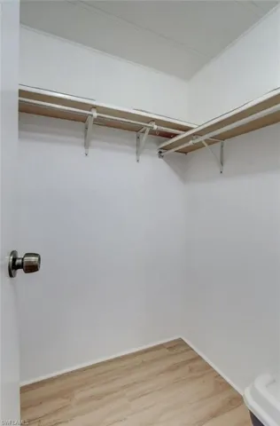 Walk in closet featuring light wood-type flooring