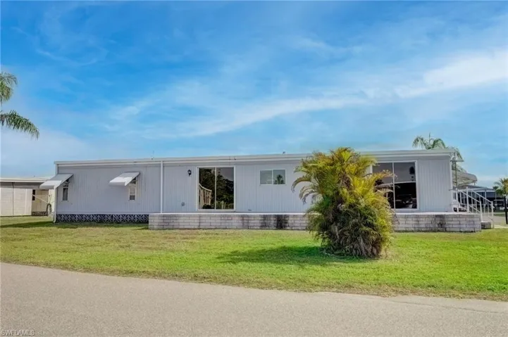 View of front of house with a front lawn
