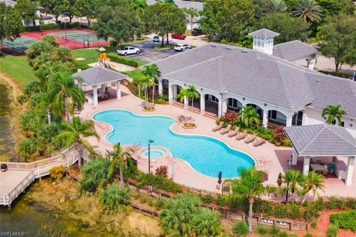 Community pool featuring a patio area, a hot tub, and a gazebo