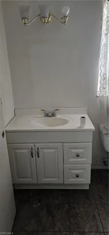 Bathroom with vanity and tile patterned flooring