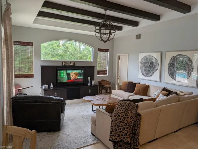 Living room with pocket door to the 4th bedrom-bath and seperate entry door to outside