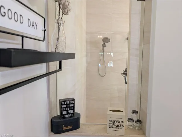 Primary Bathroom featuring tiled  walk in shower