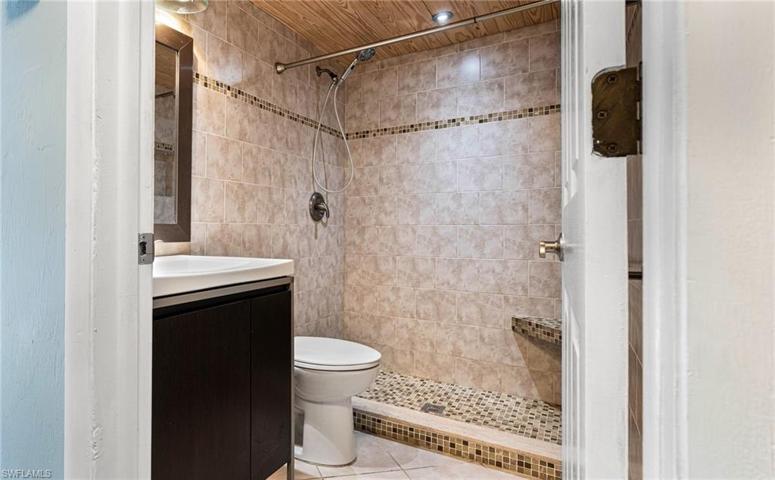 Exquisite bathroom with stunning raw wood ceilings