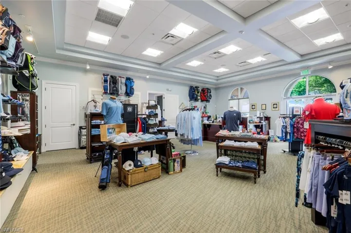 Misc room with carpet flooring and a drop ceiling