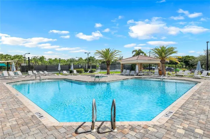 Community pool with a gazebo and a patio area